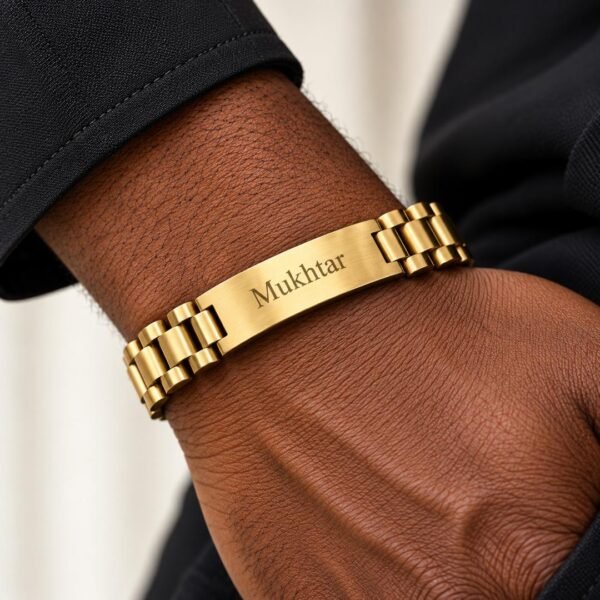 Gold personalised name bracelet with custom engraved name on a man's wrist